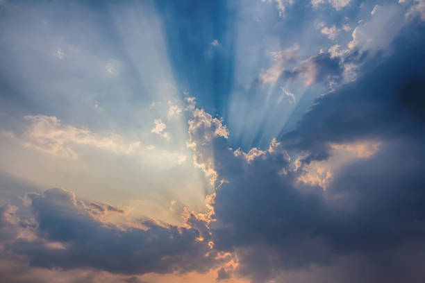 istock Besutiful ray of sunlight breaking through clouds at sunset. 1201079498