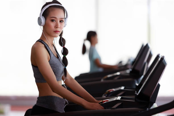 Fitness Woman Wearing Headphone Workout At Fitness Gym Stock Photo - Download Image Now - iStock