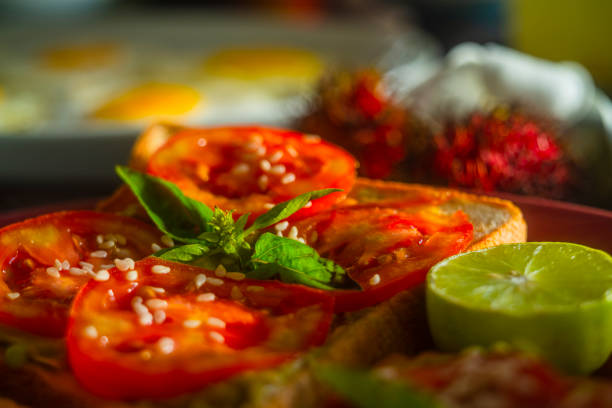 Fresh vegetarian Indian-stylized sandwiches with tomatoes and greens. Close-up photo.
