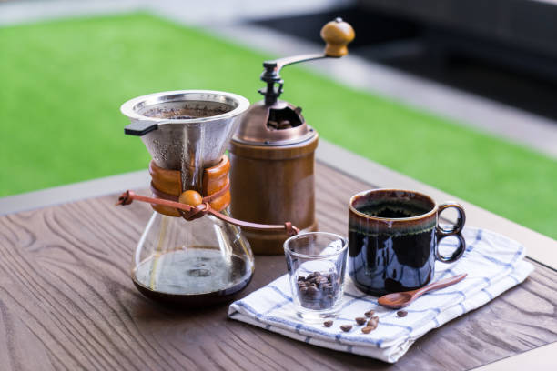 Coffee drip equipment set on wooden table. stock photo