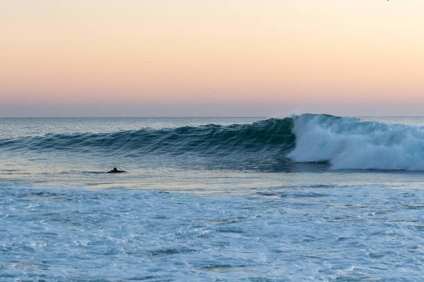 Surfing Surfing famous Anchor Point near Taghazout, Morocco sunset agadir marocco stock pictures, royalty-free photos & images
