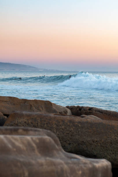 Surfing Surfing famous Anchor Point near Taghazout, Morocco sunset agadir marocco stock pictures, royalty-free photos & images
