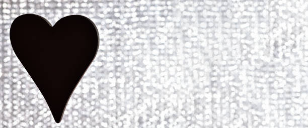 istock Banner. Heart. One black heart hangs on a silver background. Horizontal photo 1201088527