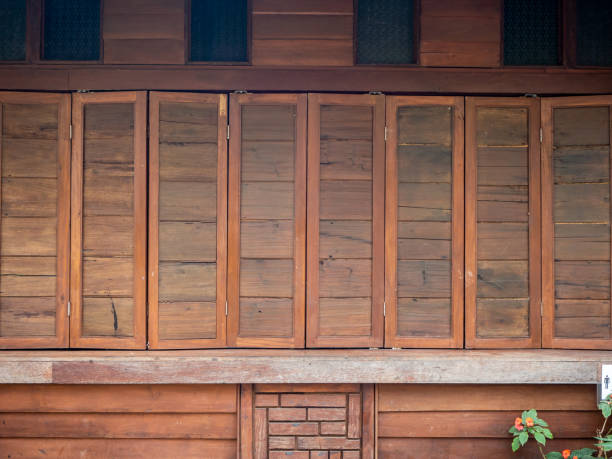 istock The wood wall and window on stones basement 1201092508