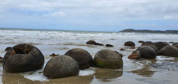 istock Beautiful Spherical stone in sea beach 1201092798