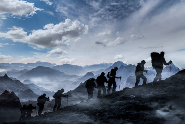 istock Silhouettes of hikers 1201095700