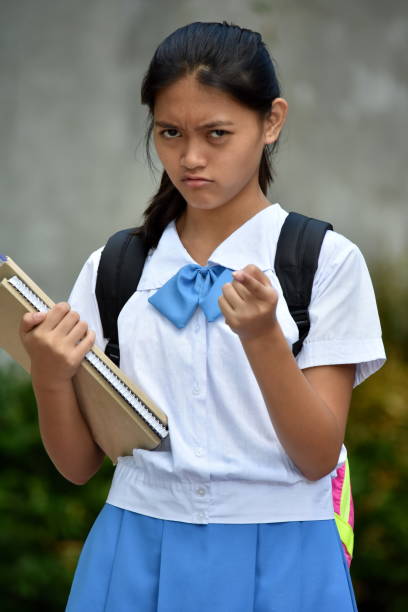 istock A Filipina Female Student Pointing 1201097117
