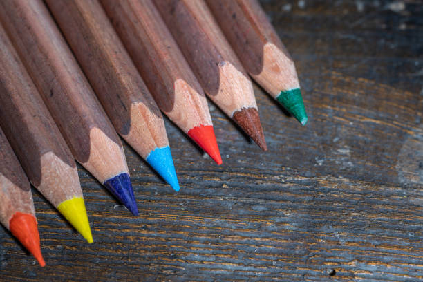 istock Colored pencils on an old wooden surface 1201098608
