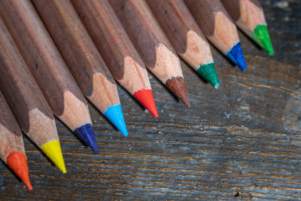 istock Colored pencils on an old wooden surface 1201098638