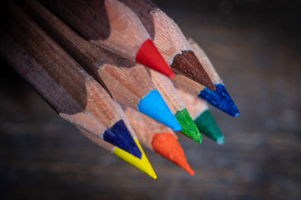 istock Colored pencils on an old wooden surface 1201099002