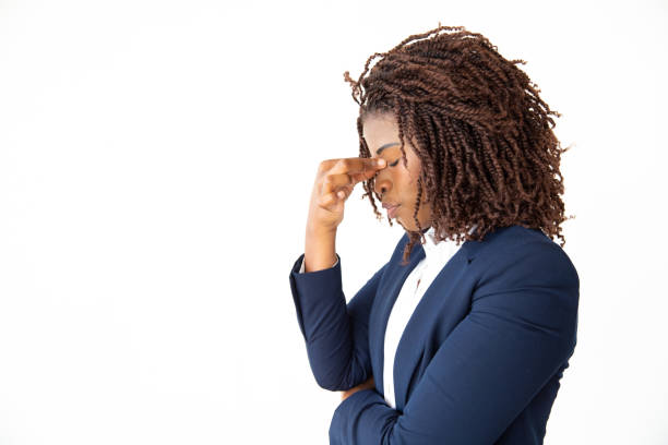 istock Stressed young businesswoman with closed eyes 1201100414