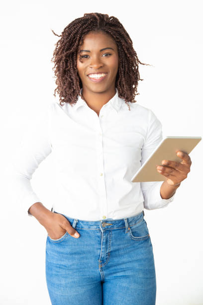 istock Happy young woman with digital tablet 1201100549
