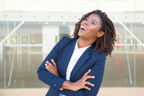 istock Cheerful young businesswoman laughing 1201101064