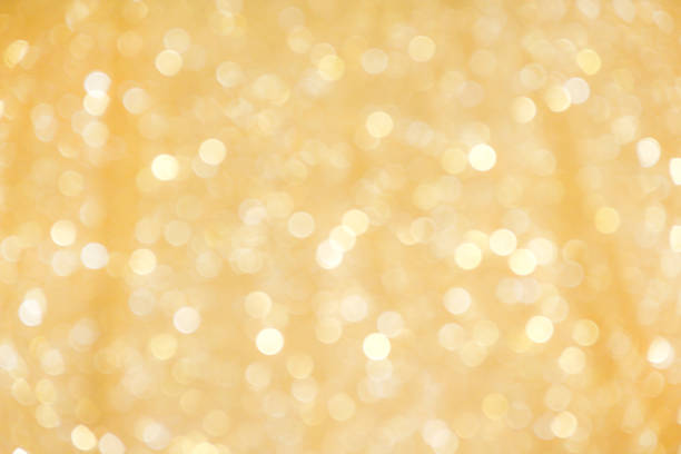 istock Gold sparkle bokeh glitter abstract on background 1201101630