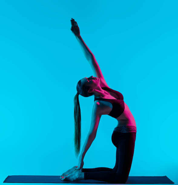 istock woman yoga exercises 1201107518