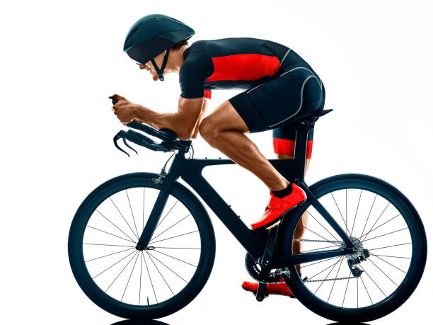 istock triathlete triathlon Cyclist cycling silhouette isolated white background 1201107625
