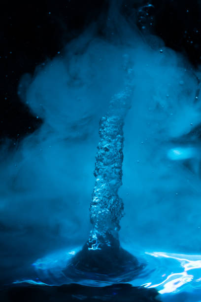 istock Space geyser in blue fog on a black starry sky 1201110834