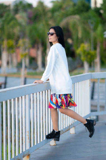 istock Fashion model posing outdoors 1201111975
