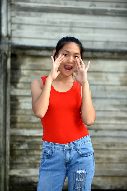 istock A Filipina Female Youngster Talking 1201117401