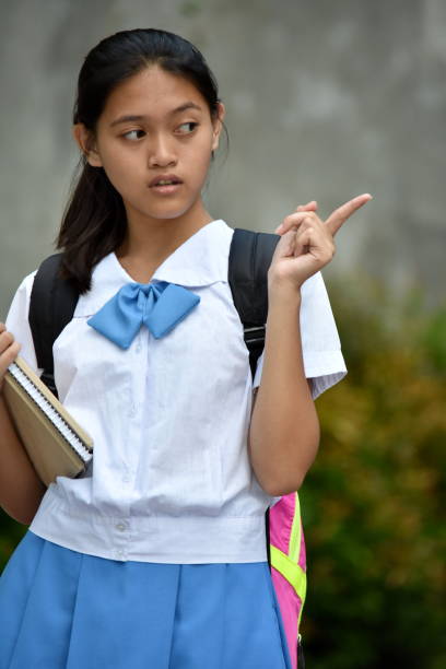 istock An A Youthful Female Student Pointing 1201120499
