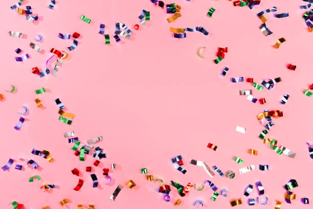 istock Colour sparkles on pink holiday background. Festive backdrop for your projects. 1201122095