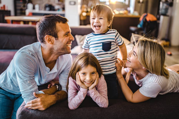 istock Happy parents having fun while enjoying with their small kids at home. 1201122143