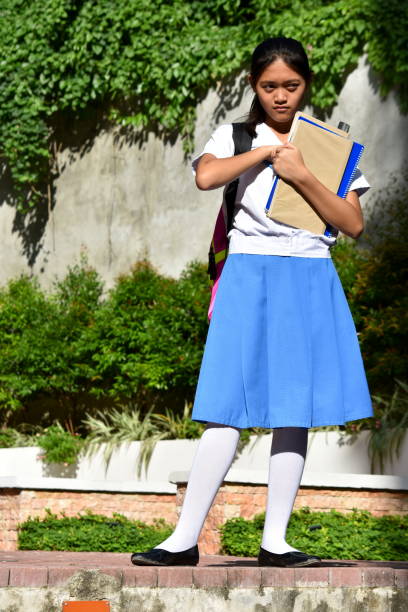 istock A Cute Female Student And Confusion 1201123509