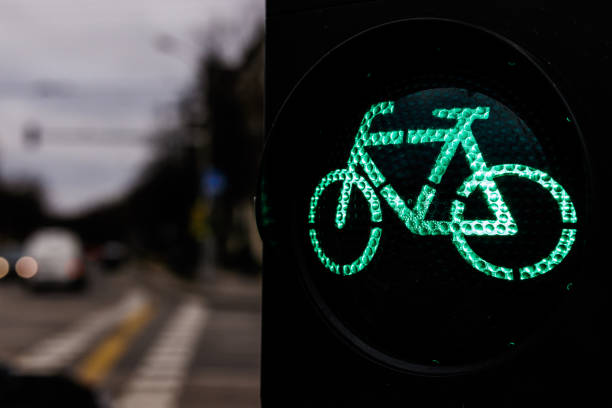 istock Traffic light for cyclists. Green light for bycicle lane on a traffic light. 1201124057