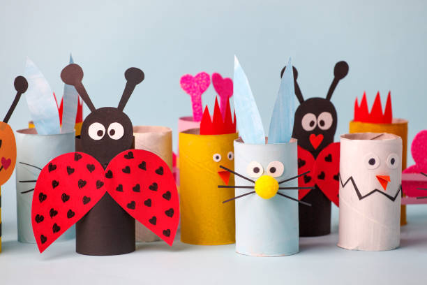 istock Paper rabbit, chicken, egg for happy easter spring party. Easy crafts for kids on blue background, copy space, diy creative idea from toilet tube roll, recycle reuse eco concept 1201124169