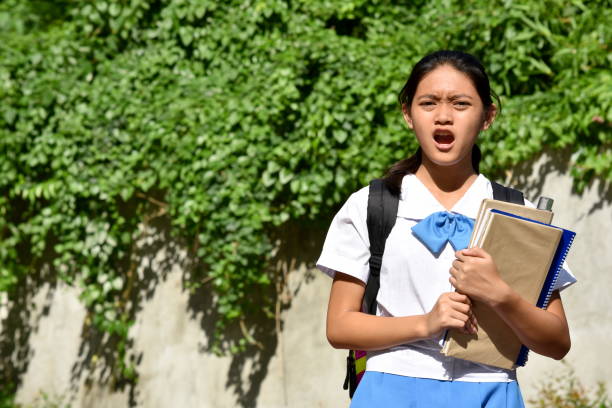 istock A Startled Youthful Asian Female Student 1201126082