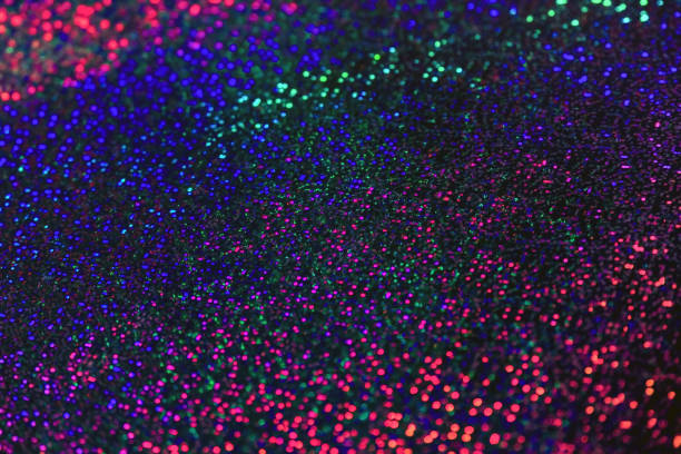 istock Multicolored shiny flickering abstract background. Blue, red, purple bokeh lights. Festive backdrop, texture 1201130109