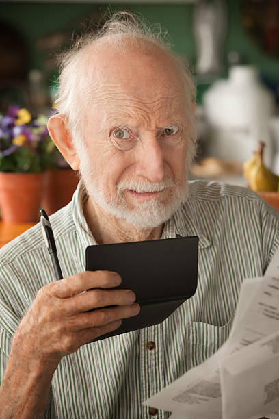istock Senior man with many bills 120113170