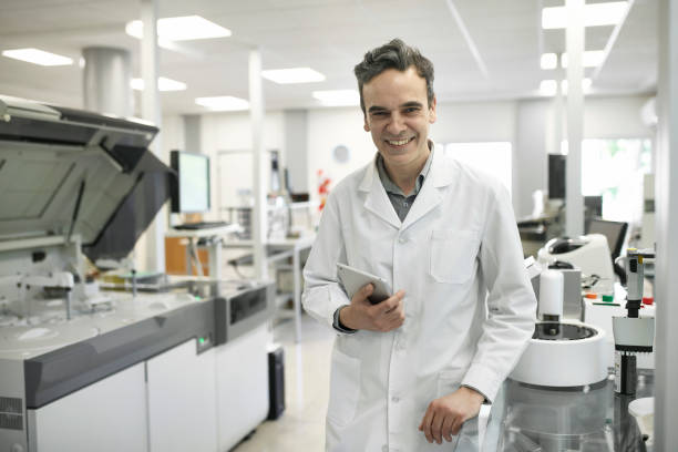 istock Working Portrait of Smiling Hispanic Male Pathologist in Lab 1201133422