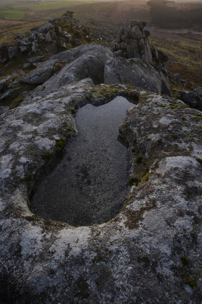 istock Pool formed by wind weathering on Kilmar Tor Bodmin Moor 1201135815