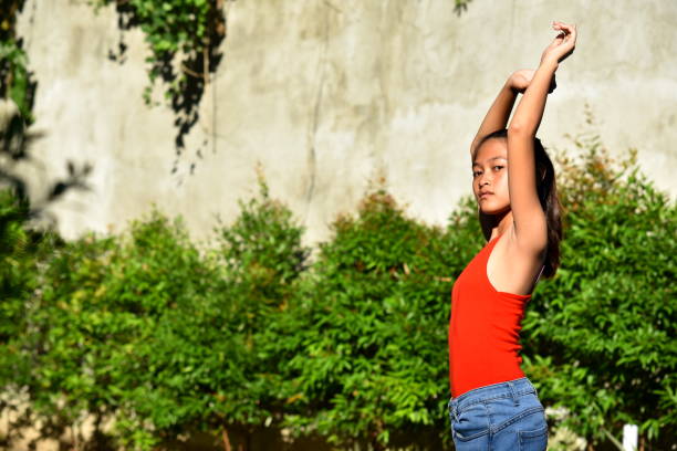 istock A Stretching Cute Minority Female 1201137214