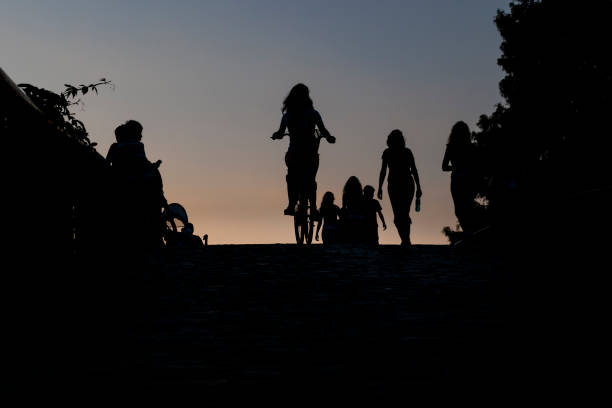 istock Silhouettes on a footbridge 1201137859