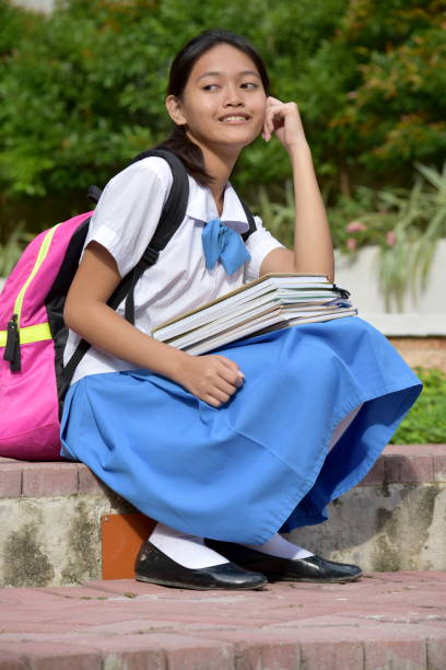 istock A Pretty Asian Female Student Thinking 1201138374