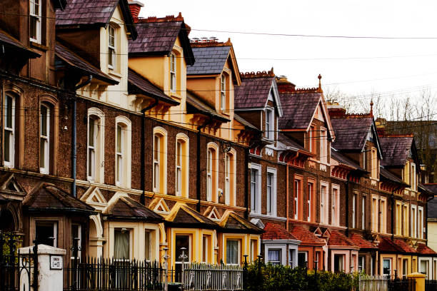 Brightly painted villa houses in the suburbs. Historical places of Europe. Cork, Ireland Brightly painted villa houses in the suburbs. Historical places of Europe. Cork, Ireland county cork stock pictures, royalty-free photos & images