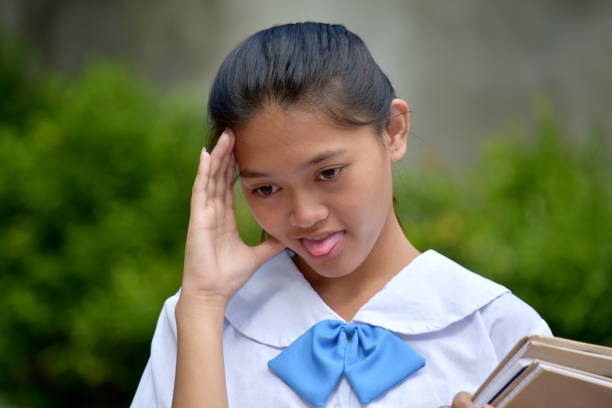 istock Girl Student And Illness With School Books 1201141270