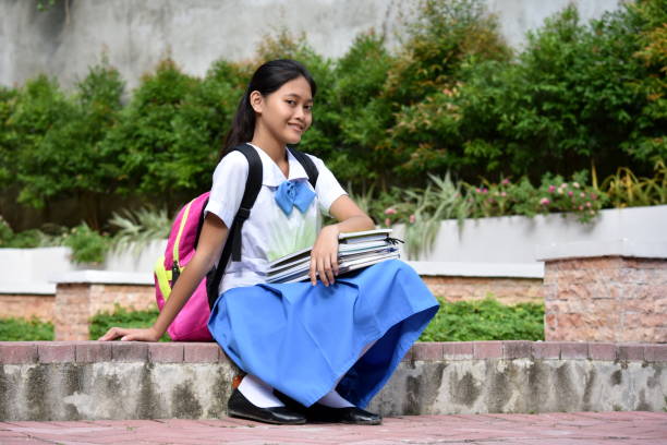istock A Sitting Young Diverse Girl Student 1201141657