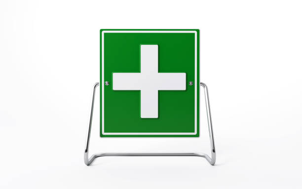 Green first aid road sign on white background, Horizontal composition with clipping path and copy space.