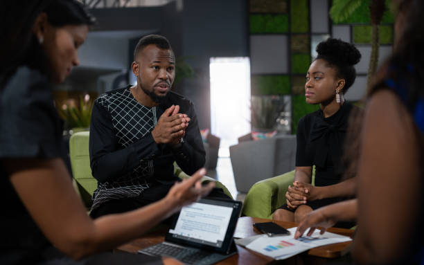 Black african business analyst in strategy meeting. Using hand gestures with serious and concerned tone