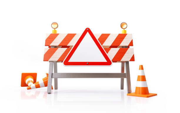 istock Traffic Cones Construction Barrier And A Red Triangle Shaped Road Sign On White Background 1201144270