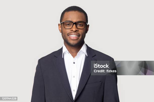 Smiling Black Man In Suit Posing On Studio Background Stock Photo - Download Image Now
