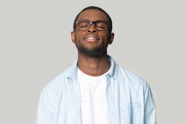 istock Calm african American man dreaming with eyes closed 1201144366