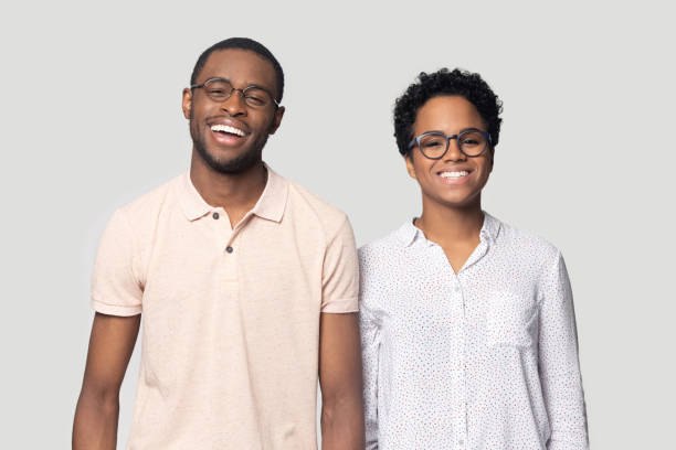 istock Smiling ethnic couple laugh posing for picture in studio 1201144413
