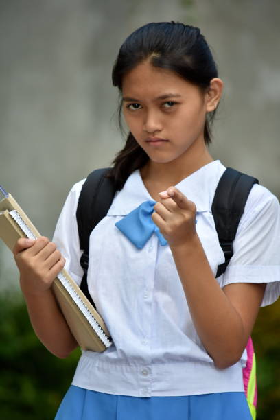 istock An A Pointing Youthful Girl Student 1201146241