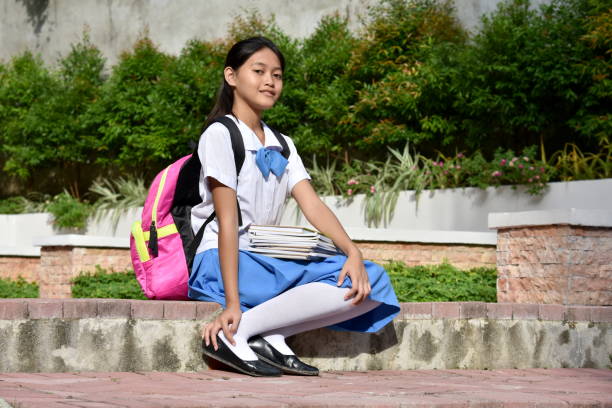 istock A Young Diverse Girl Student Sitting 1201148729