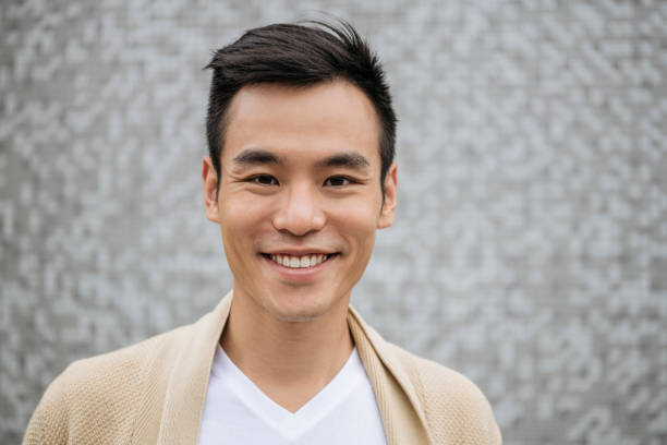 istock Handsome mid adult man smiling at camera 1201150755