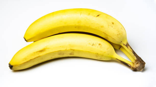istock Fresh Bananas on White Counter 1201151031